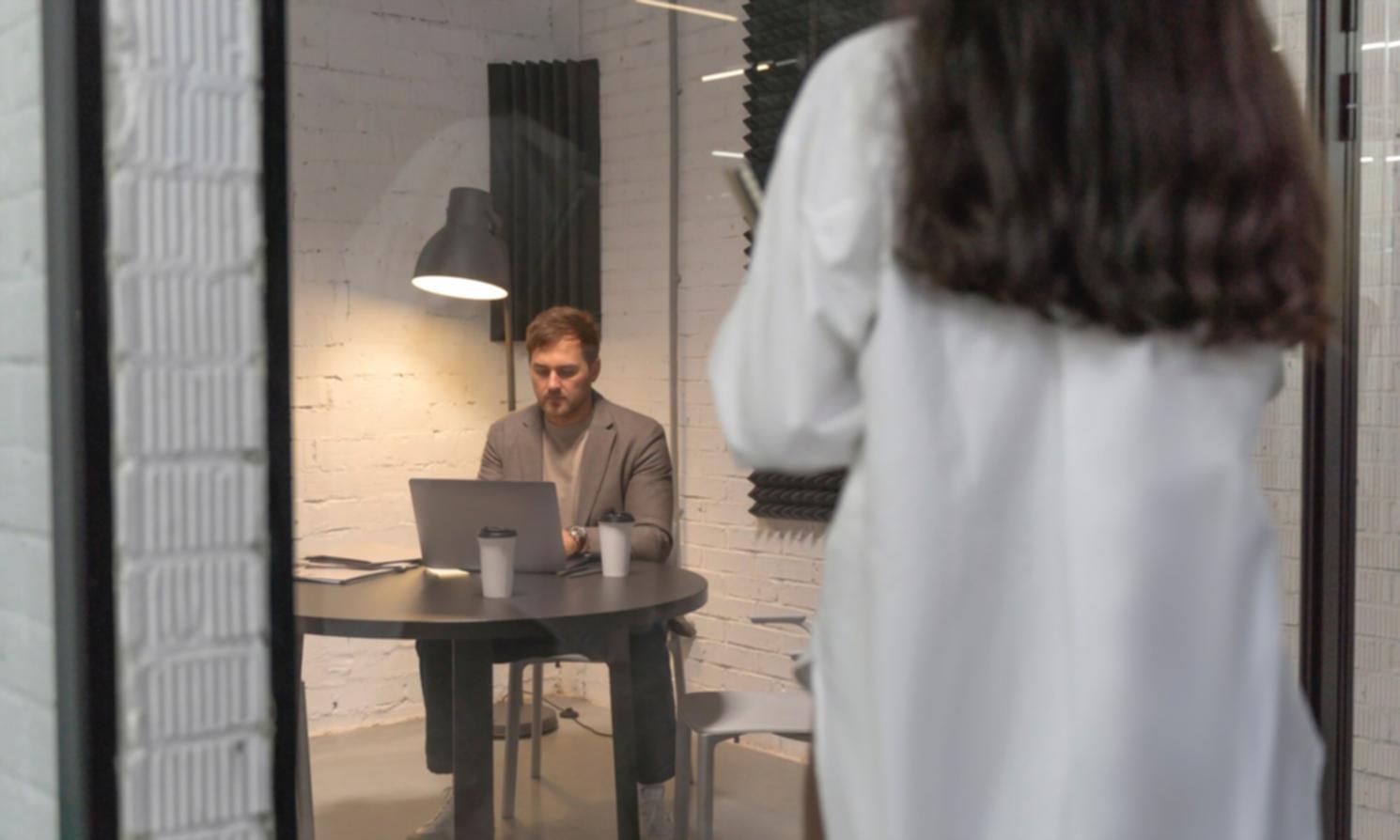 Financial analysis and strategic planning documentation spread across desk